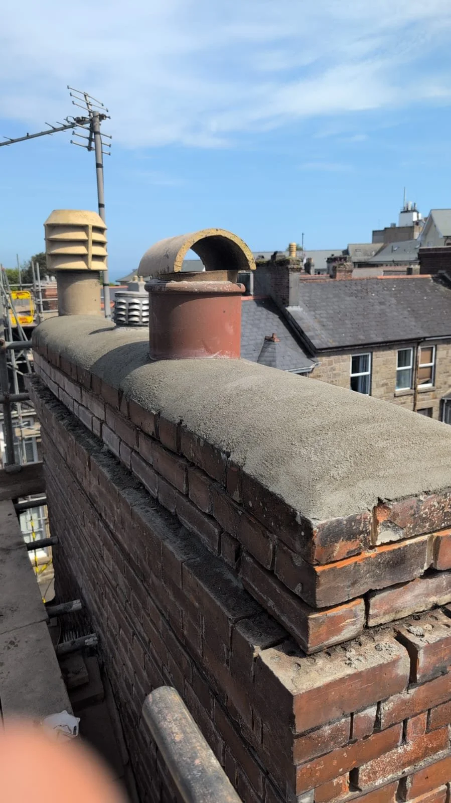 Rebuilt chimney stack with new mortar haunching and pots, Cornwall