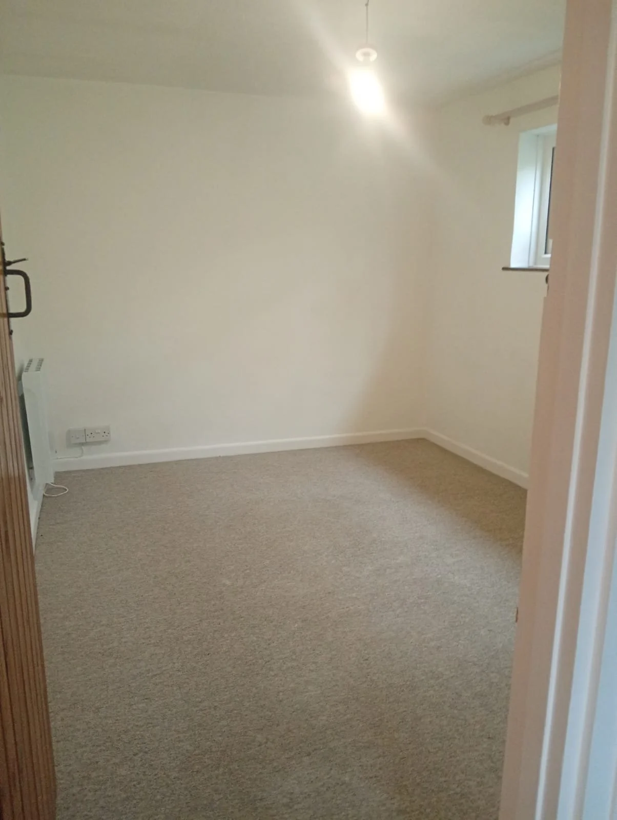 Empty room with new carpet, cleaned and ready to let between tenancies in St Austell