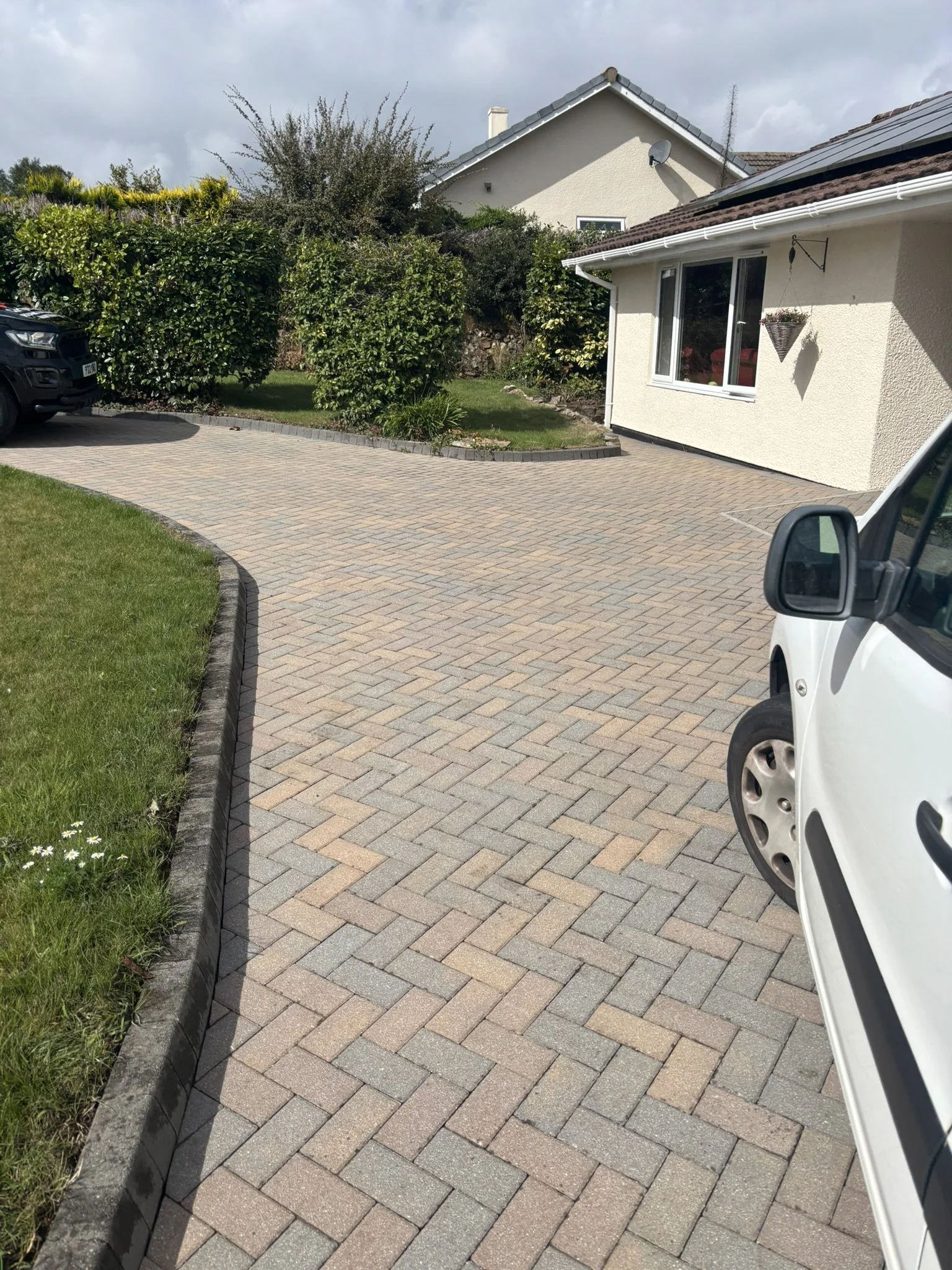 Finished block paved driveway with kerb edging at a Cornish bungalow