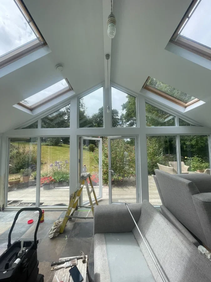 Garden room being fitted out at Newmill Cottage, with apex glazing and roof windows installed