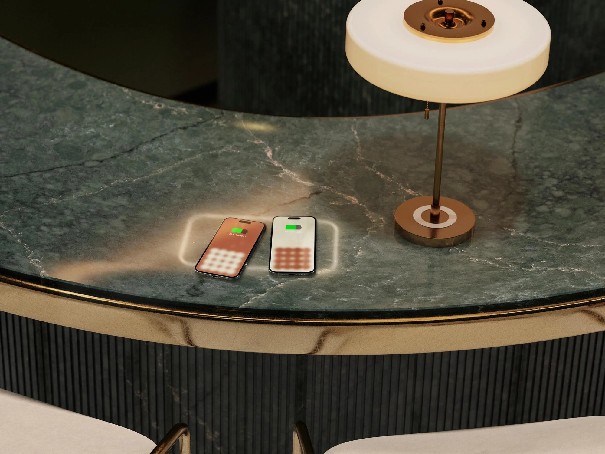 Jacksonville wireless charging marble countertops Two smartphones with glowing screens showing charging icons are placed on a marble table next to a modern table lamp.