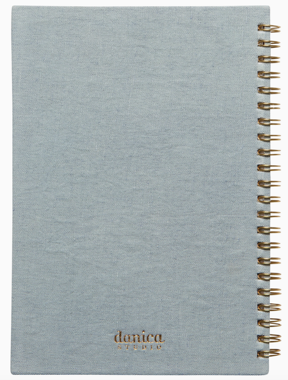 A blue-covered notebook with a spiral binding, resting on a flat surface.