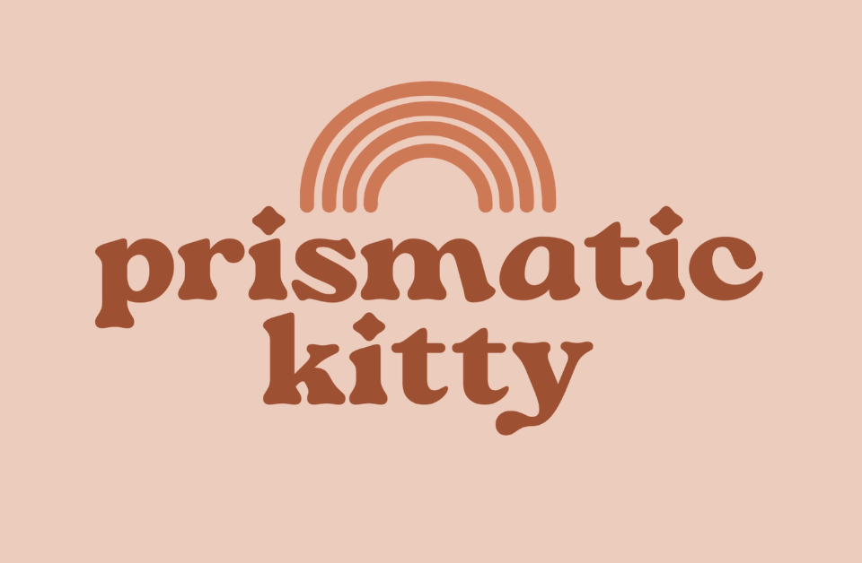 Colorful prismatic logo featuring a stylized cat silhouette against a vibrant background.Colorful prismatic logo featuring a stylized cat silhouette against a vibrant background.