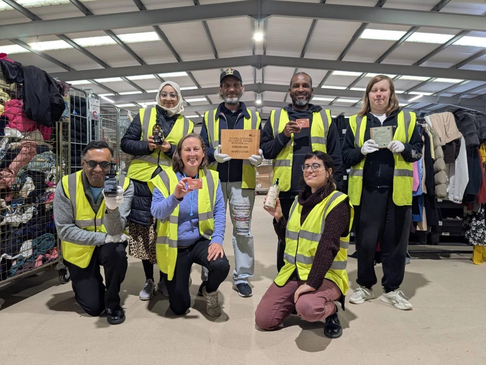 Team celebrating Crisis Opening Doors award