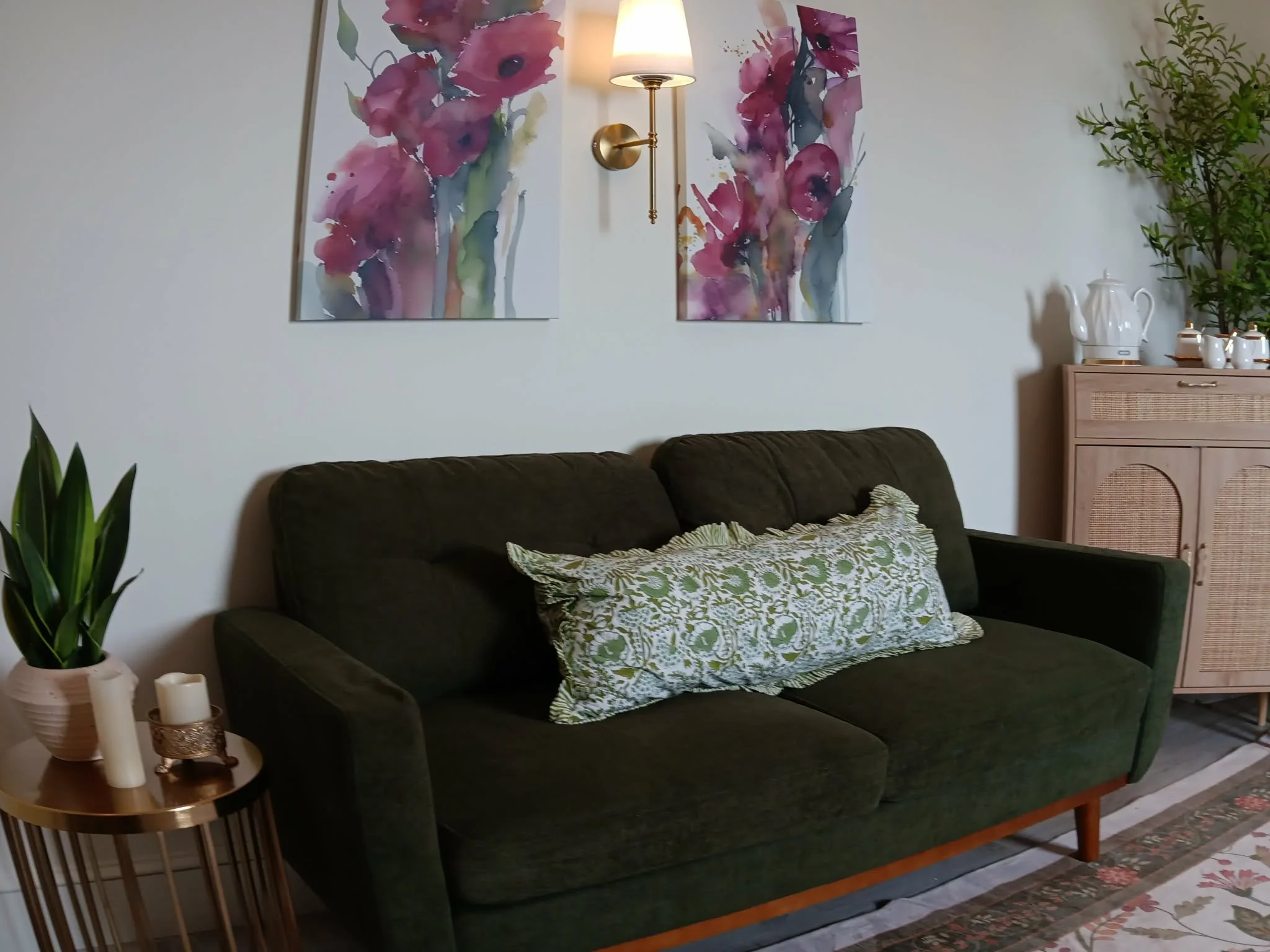 Comfy couch and artwork in ultrasound suite.