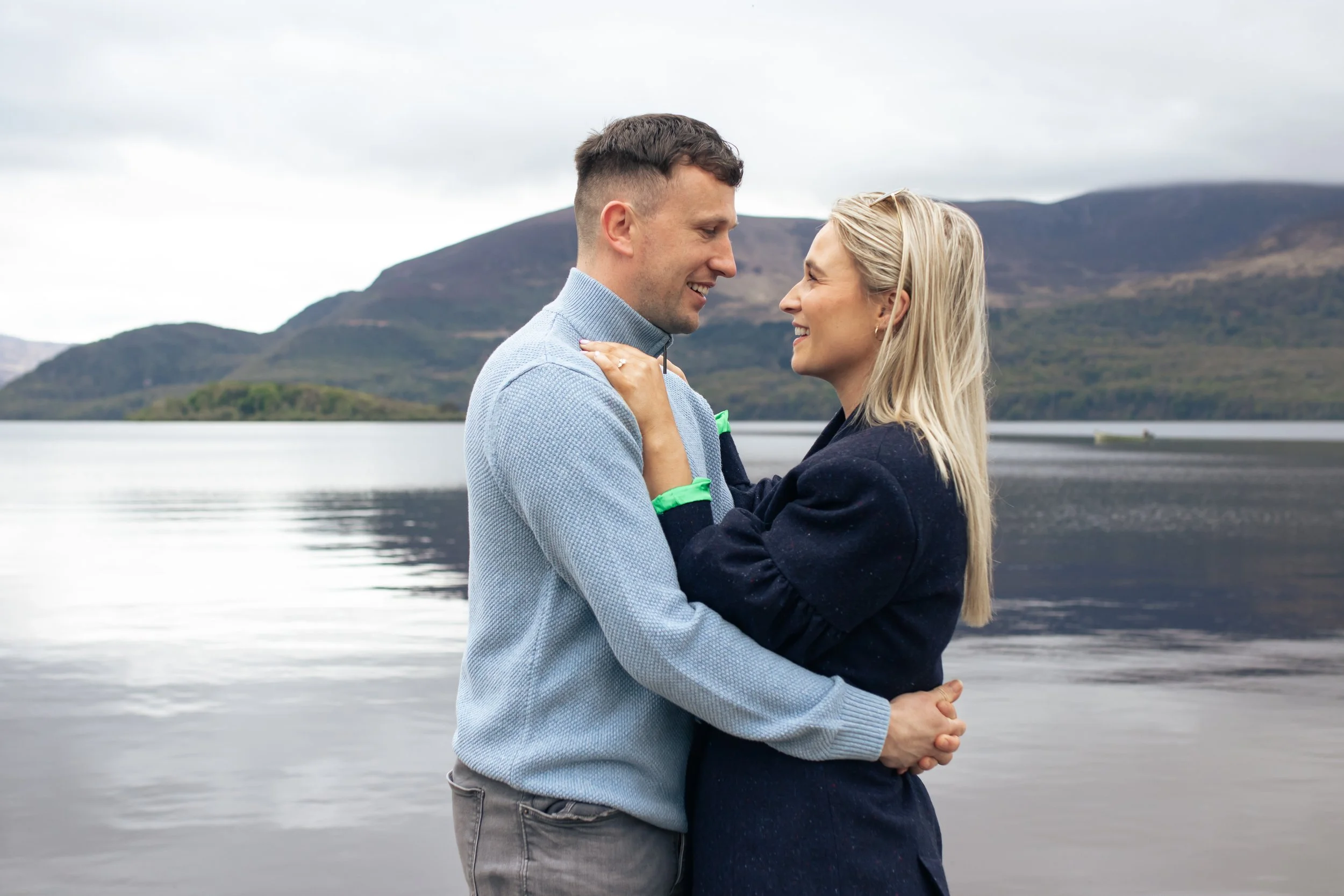 Engaged couple celebrating their proposal at Killarney Europe Resort in Ireland, captured by WEDEUX Proposals – experts in romantic proposal planning and photography.