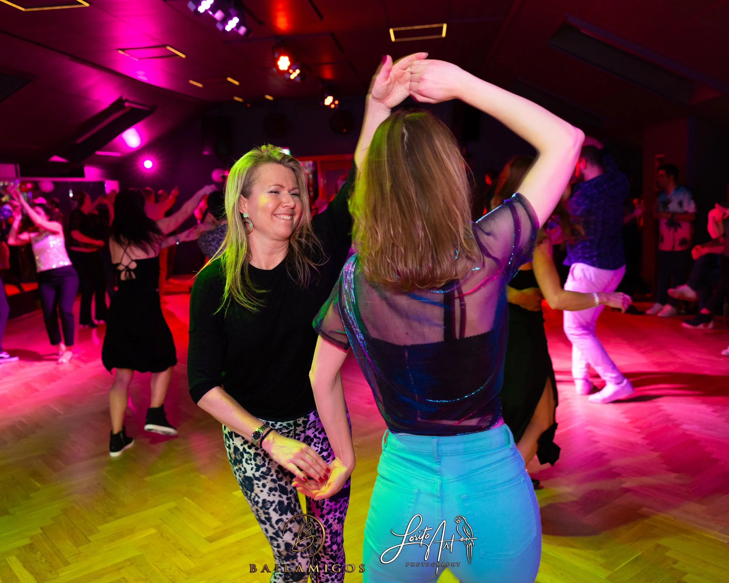 two-women-dancing-and-spinning-around