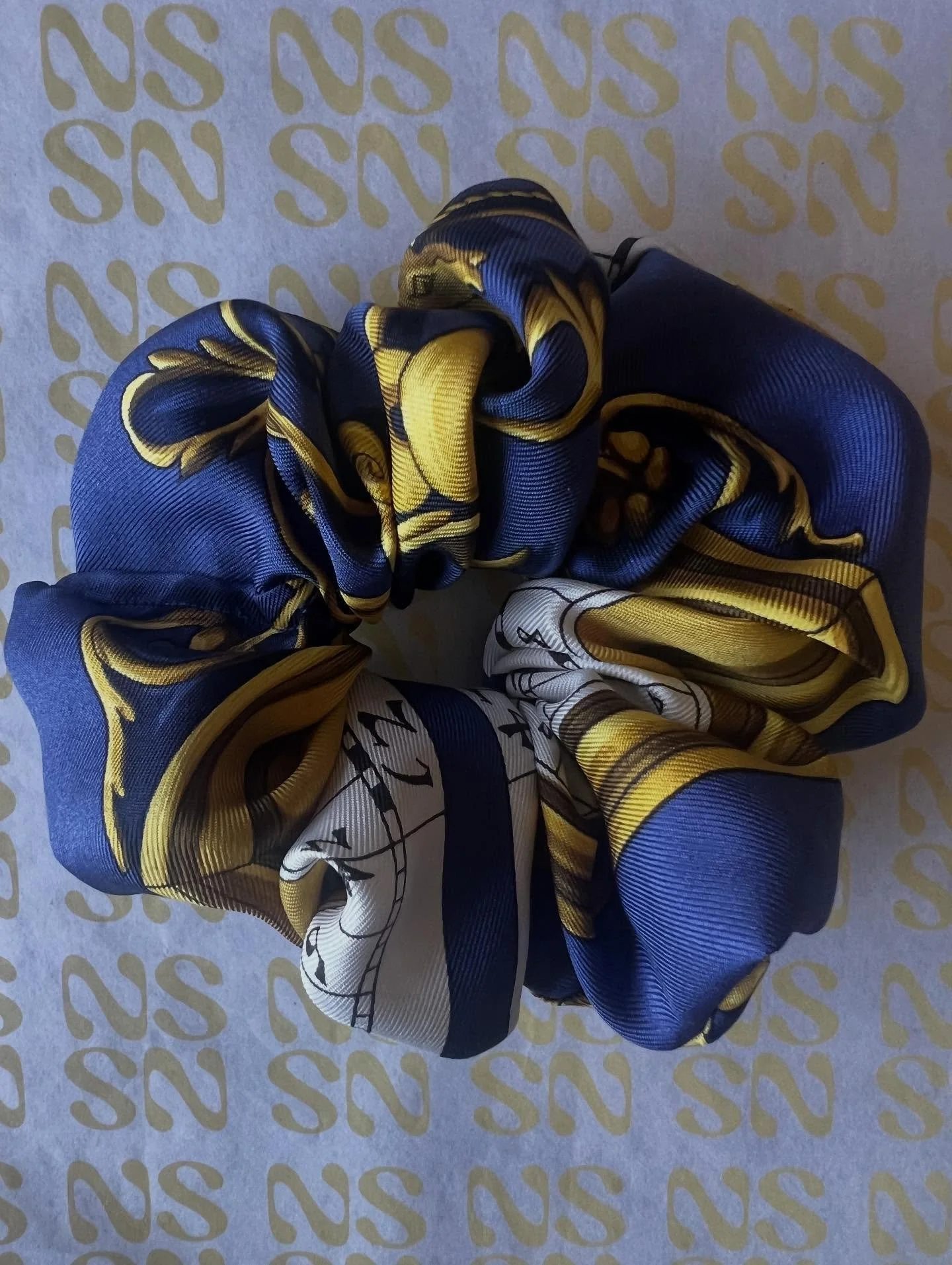 Stars written in silk.✨ This scrunchie is made using a vintage Hermes astrology scarf. First released in the 1960s and inspired by celestial charts that turned constellations into design. Now reimagined as a scrunchie with a story you can wear everyd