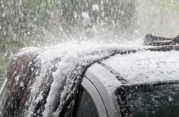 Car covered with hail during storm