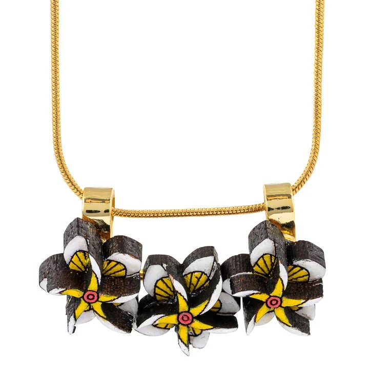 FrangipaniReclaimedWOodNecklace_34517c2d-8da1-4001-bdd2-8491aabd1b06.jpg