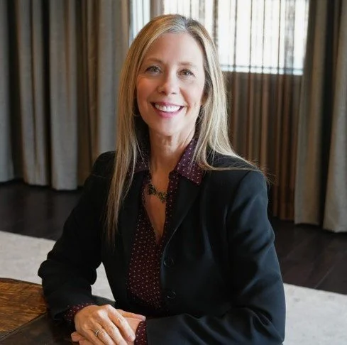 female sitting jacket blond