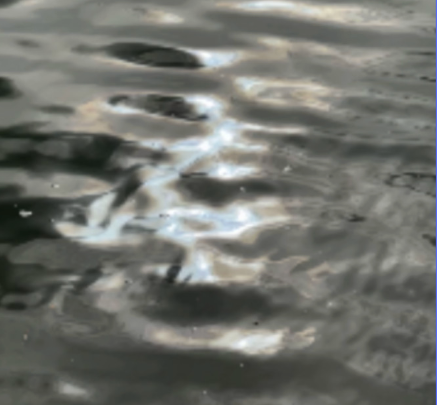 Abstract reference image of light refracting and drifting across moving water. Taken by Laura Pellegrino