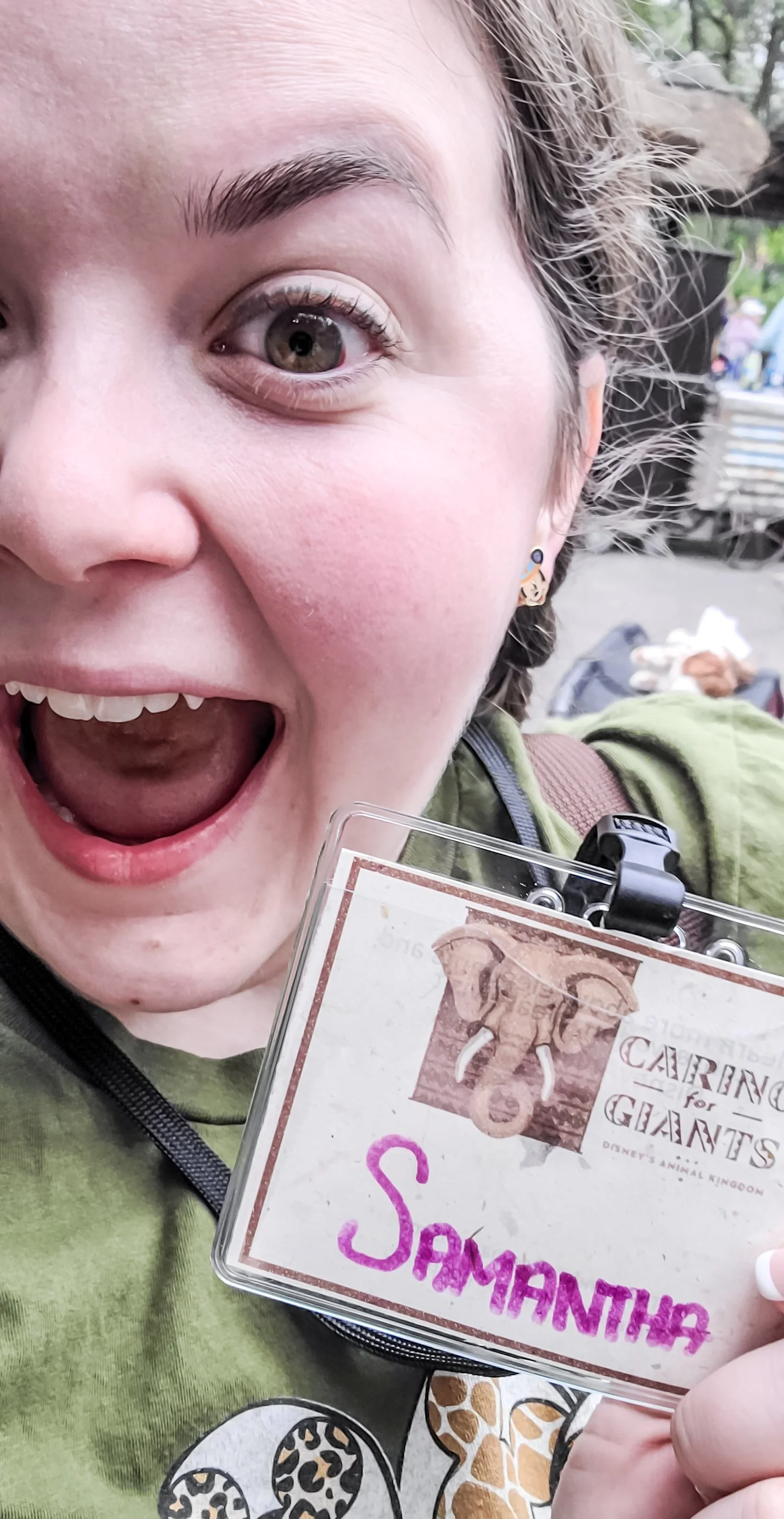 A selfie featuring the Caring For Giants nametag on Poopy Paper