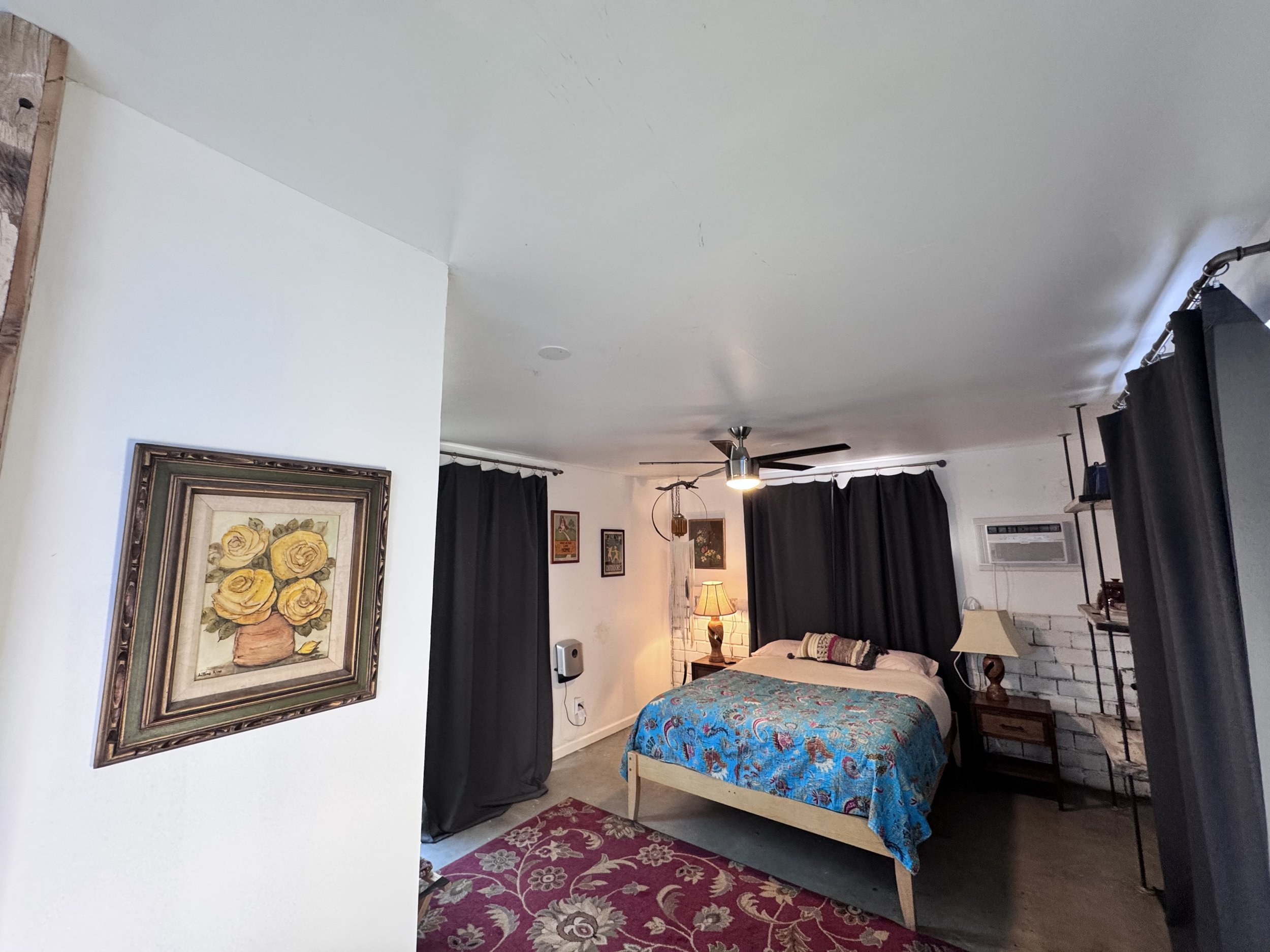 The Bungalita is a separate cottage with attached bath, queen bed, and private patio area.