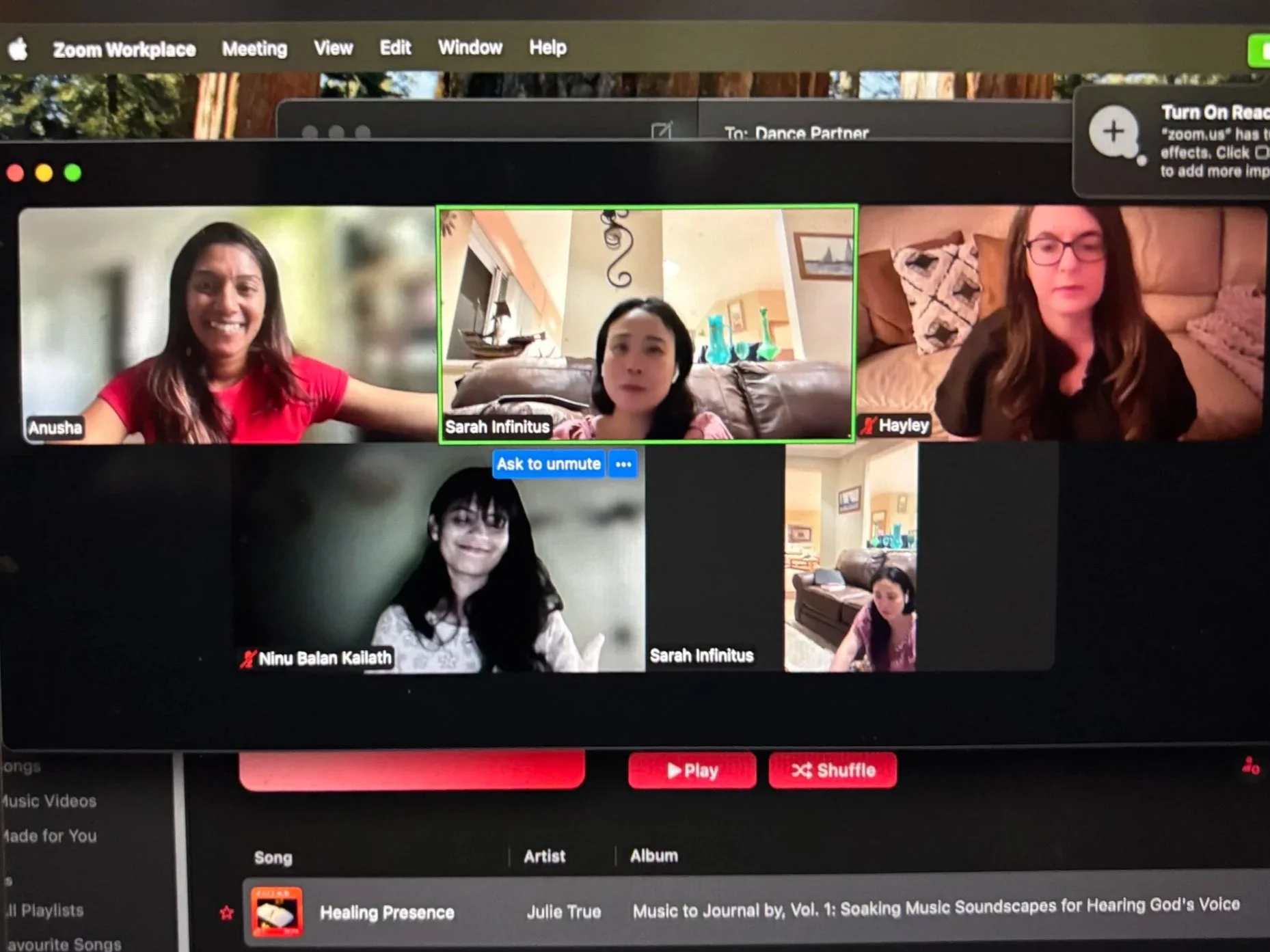 Screen of a Zoom video call with five participants, showing their video feeds in a grid. The top toolbar displays options for Zoom settings. The bottom part of the screen shows music playlist controls and song information. Four of the participants ar