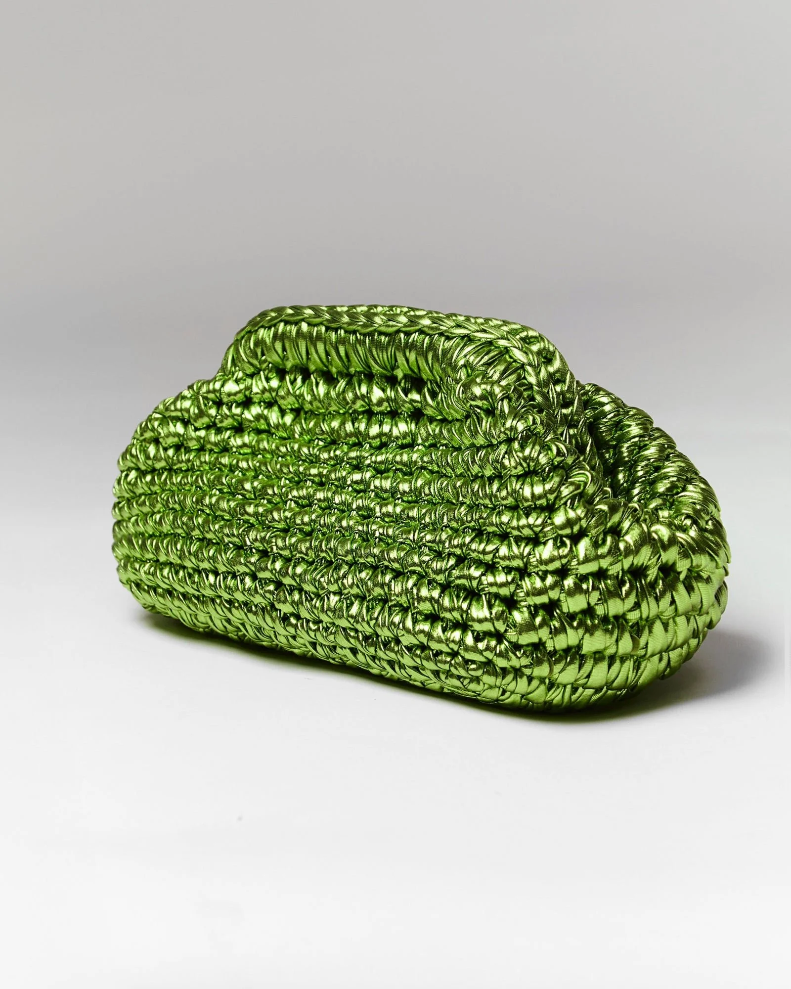 Noam Hazan Amber clutch in metallic green raffia