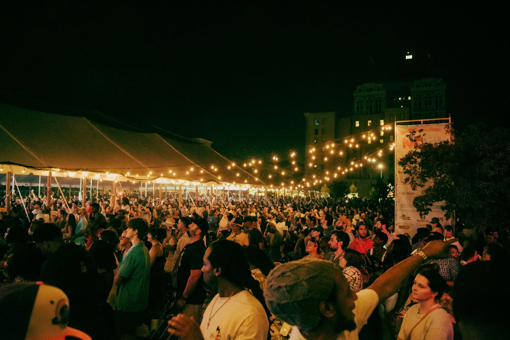 Thousands of people outside the main tent enjoying the NC Folk Festival