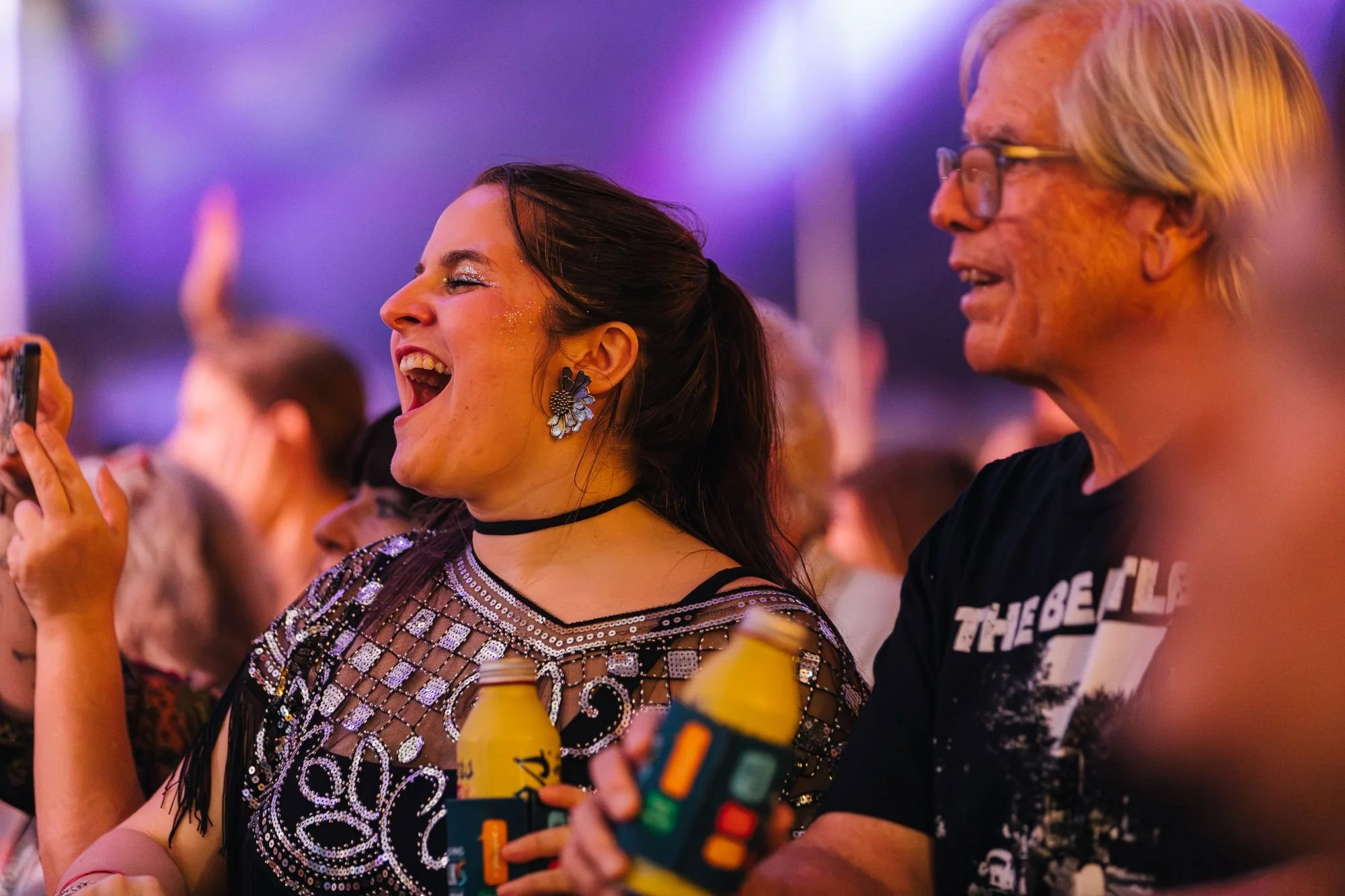 A woman and man screaming with excitement at the 2026 NC Folk Festival