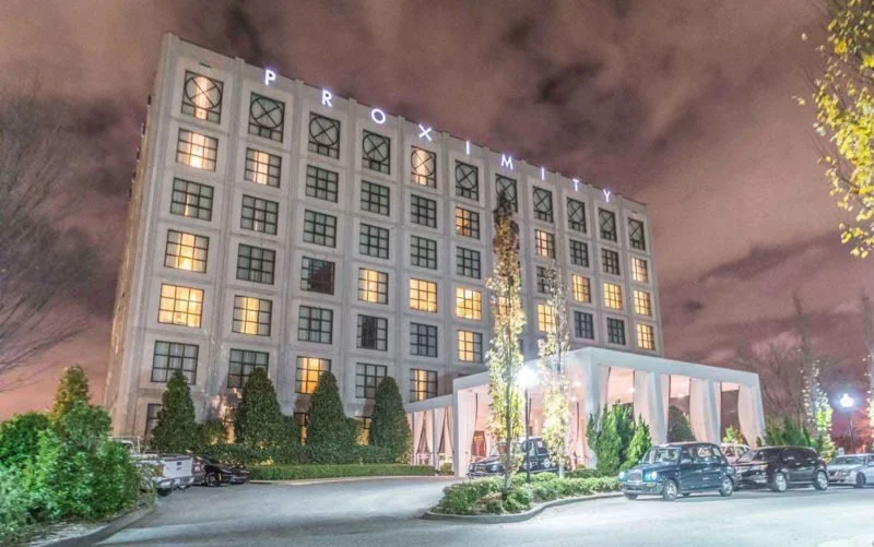 Proximity Hotel | Includes $30 Green Valley Grill or Print Works Bistro Gift Certificate, and choice of still or sparkling wine and housemade chocolate truffles