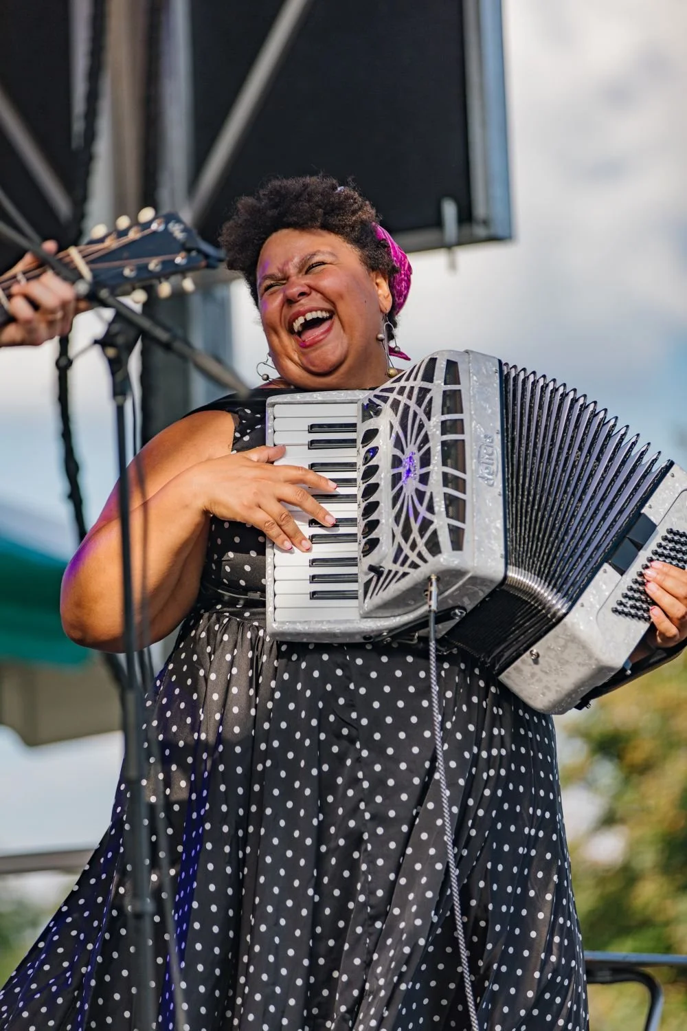 A woman playing the accordian