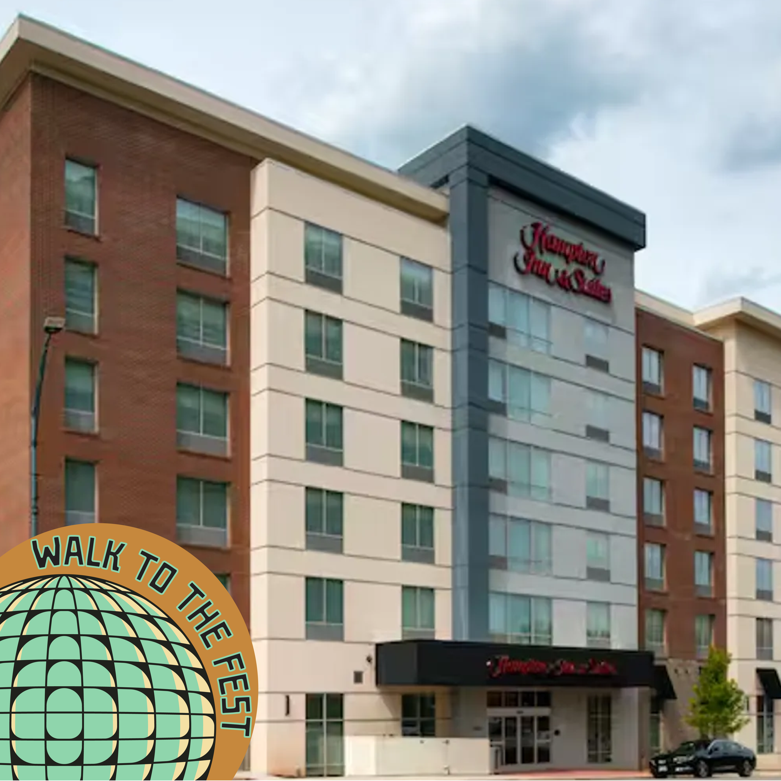 An exterior photo of the Hampton Inn in downtown Greensboro, NC.