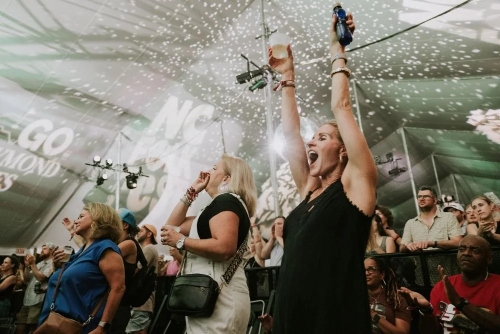 Two women screaming in excitement at the 2026 NC Folk Festival
