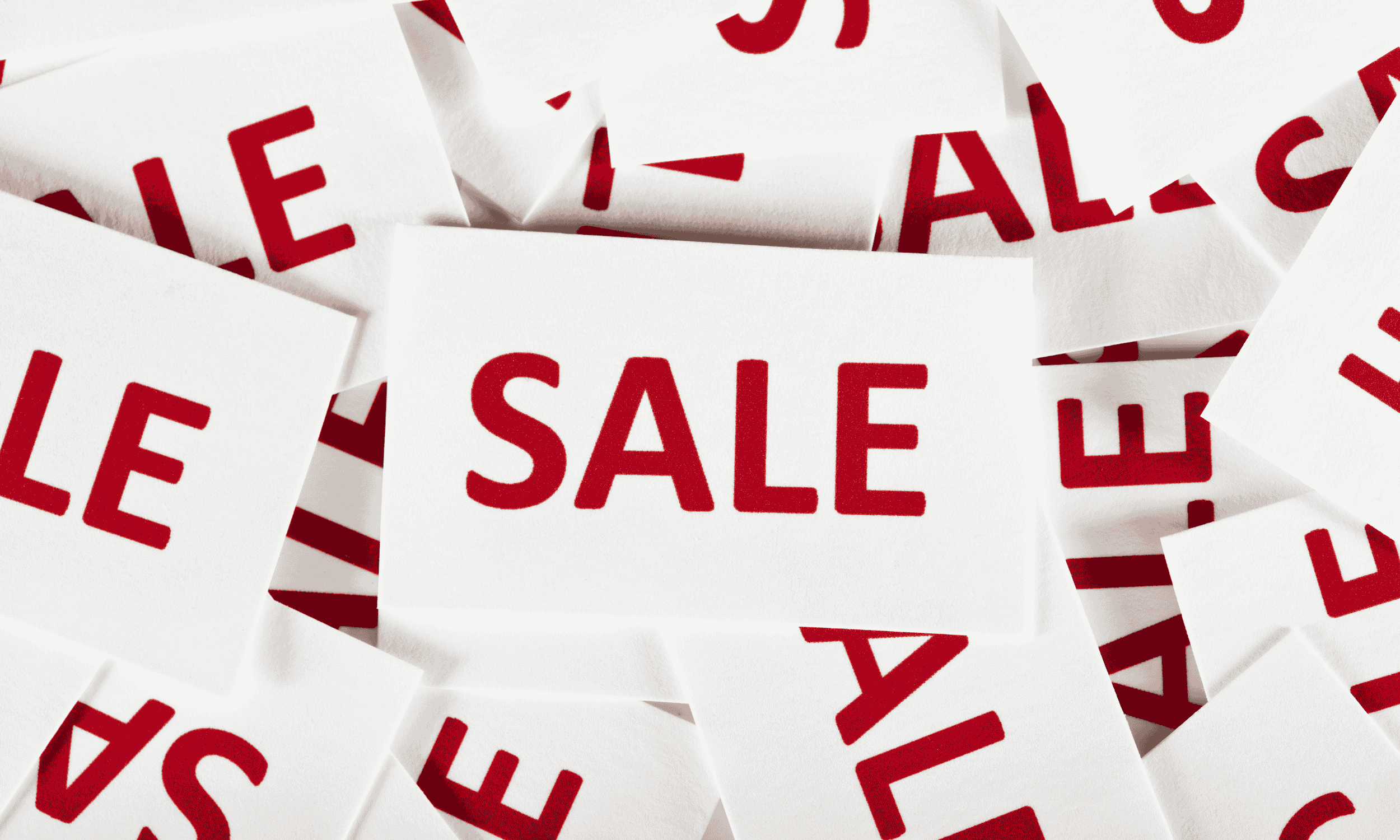 Retail sale signage representing the importance of aligning product feeds with promotions and trading activity