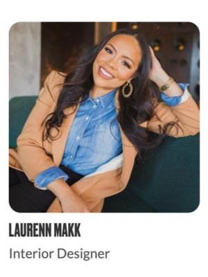 Smiling woman in business attire sits on a couch, text reads 'Laurenn Makk, Interior Designer'