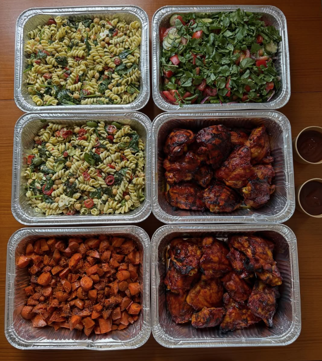 New York Tech AI Company Catered Meals Catered corporate lunch buffet BBQ chicken, glazed carrots, penne primavera