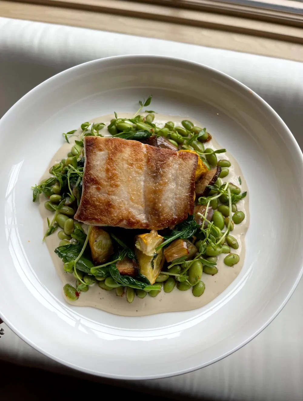 Brooklyn private chef Seared halibut with edamame, garden greens, and lemon tahini sauce Prospect Heights