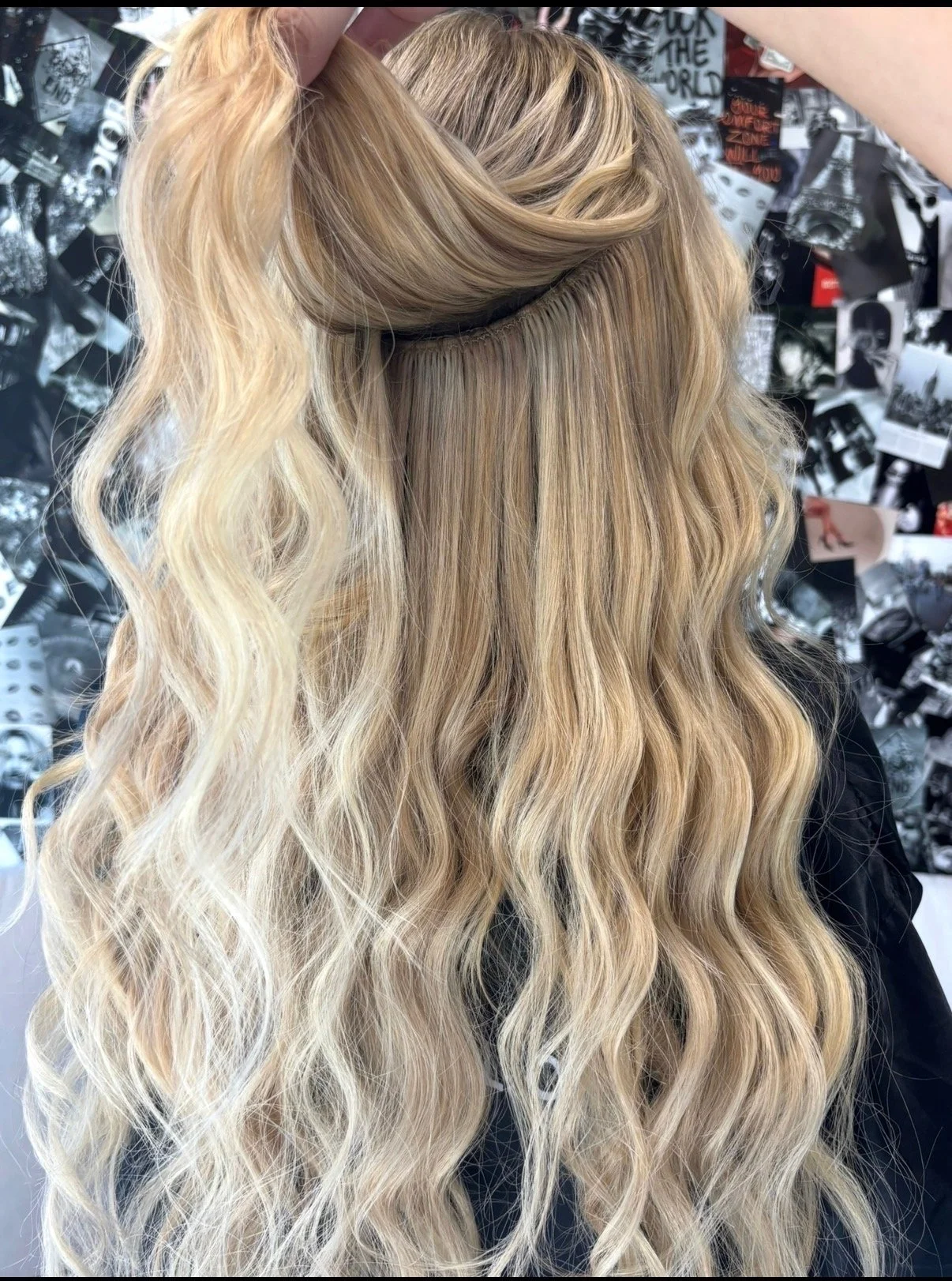 Long blonde hair with professionally installed extensions at Altair Salon in Palm City, Florida. sewn in wefts