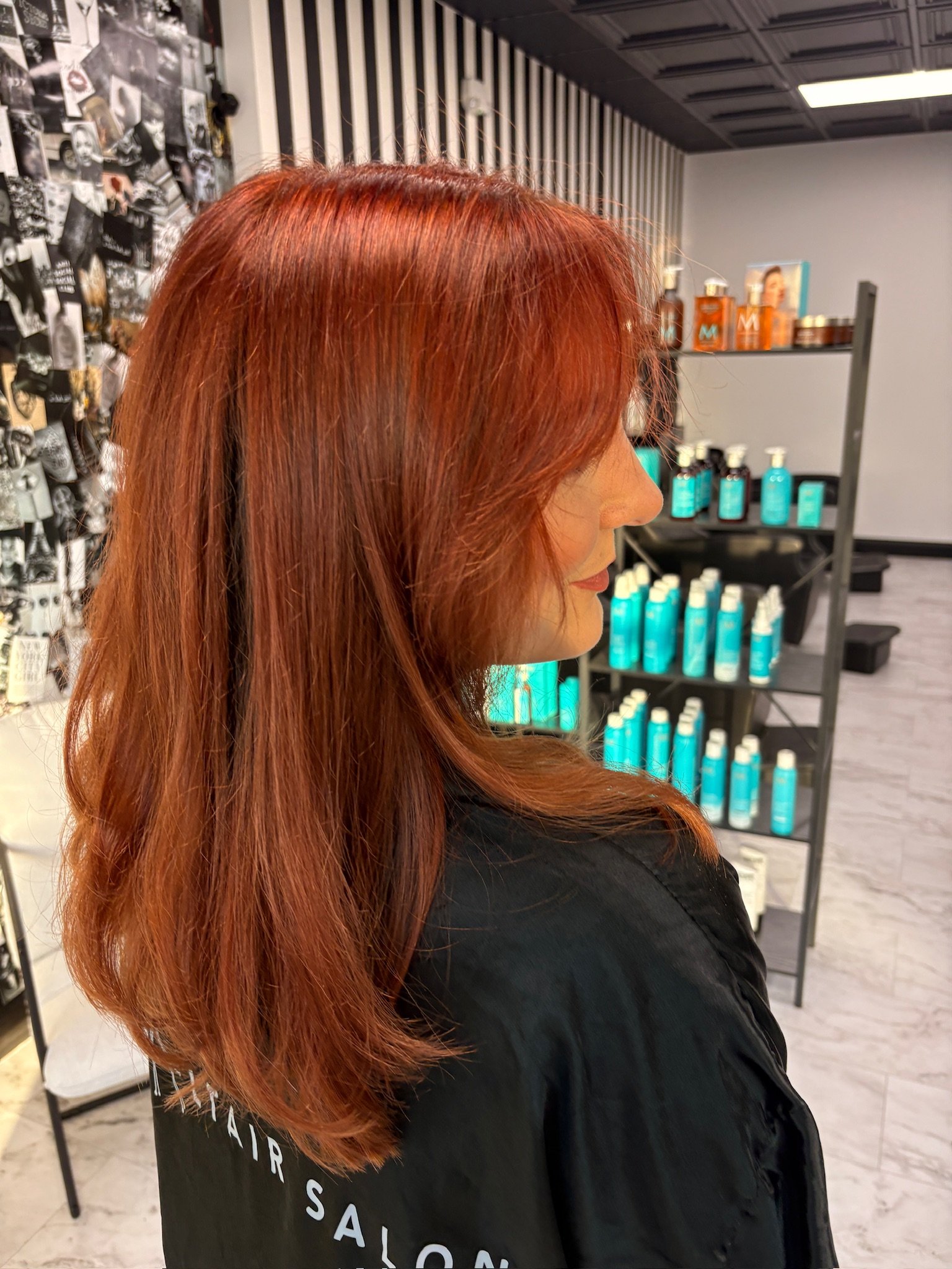 Rich copper red hair color with dimensional warmth and a glossy finish at Altair Salon in Palm City, FL. Custom red hair color and dimensional color created by our professional colorists.