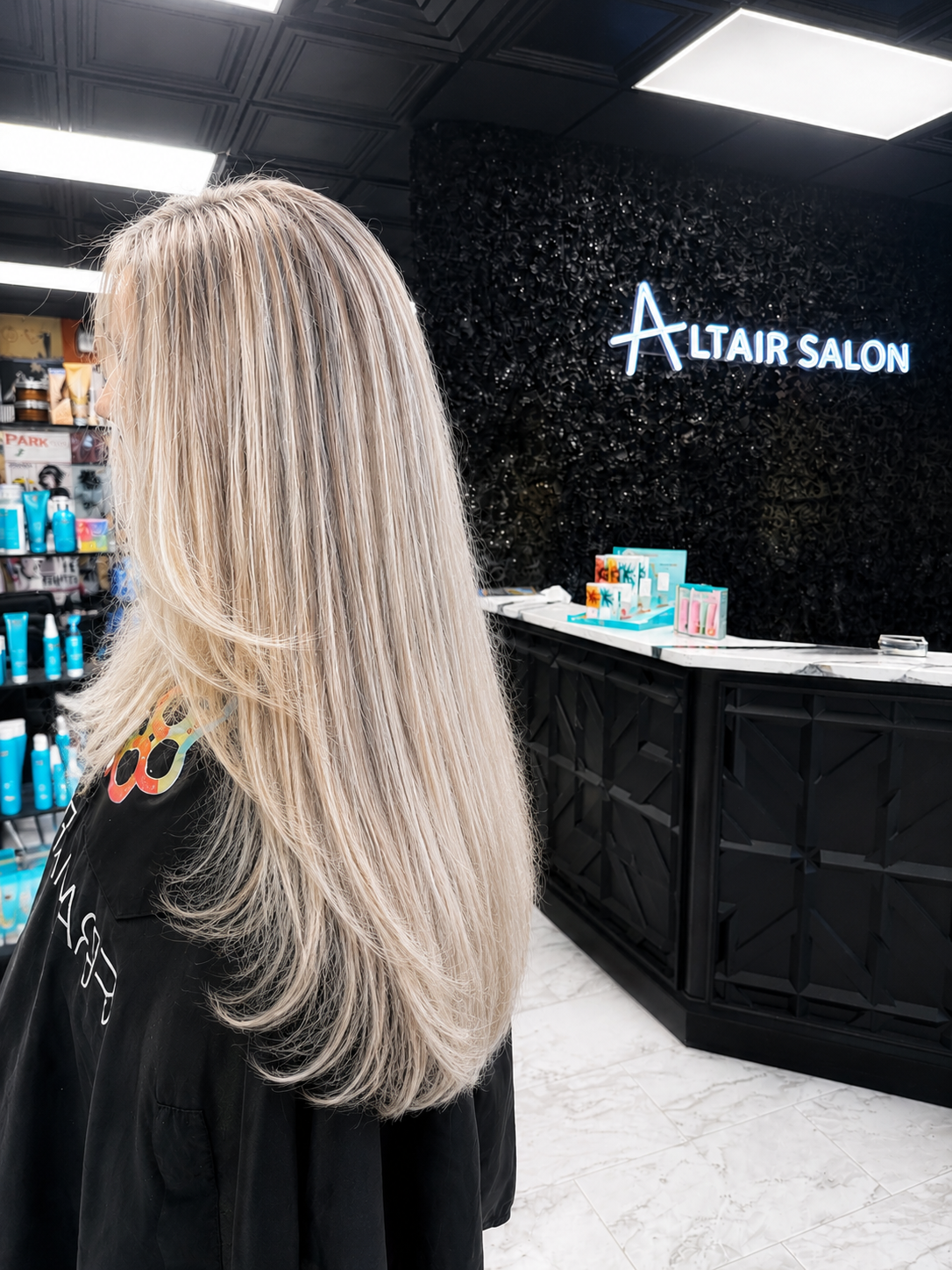 Professional hair stylist at Altair Salon, a luxury hair salon in Jensen Beach, FL specializing in custom color, blonding, balayage, hair extensions and precision haircuts
