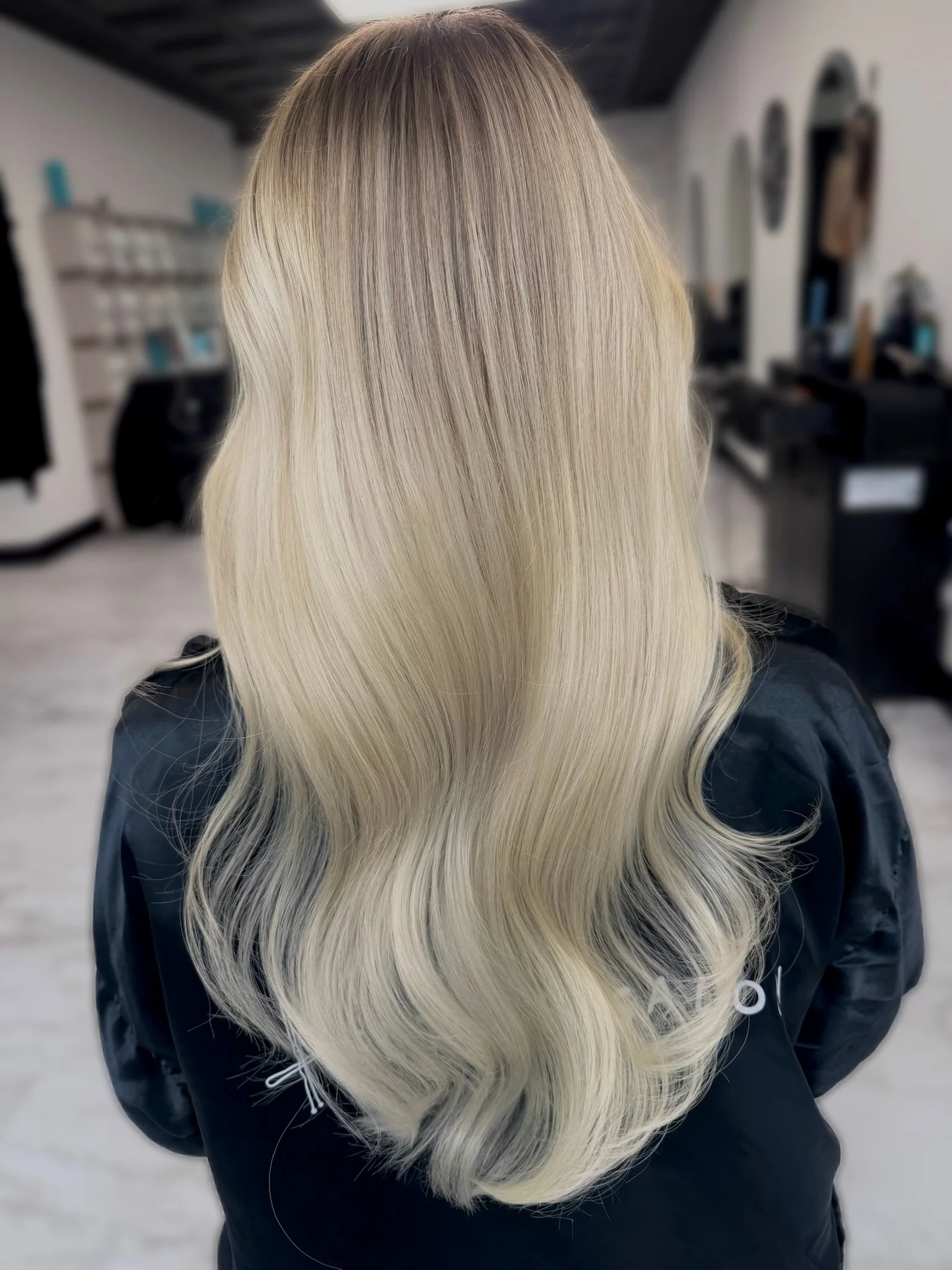 Bright platinum blonde with dimensional highlights and a seamless blend by Altair Salon, serving Stuart, FL. Customized blonding for healthy, bright, natural-looking blonde hair.