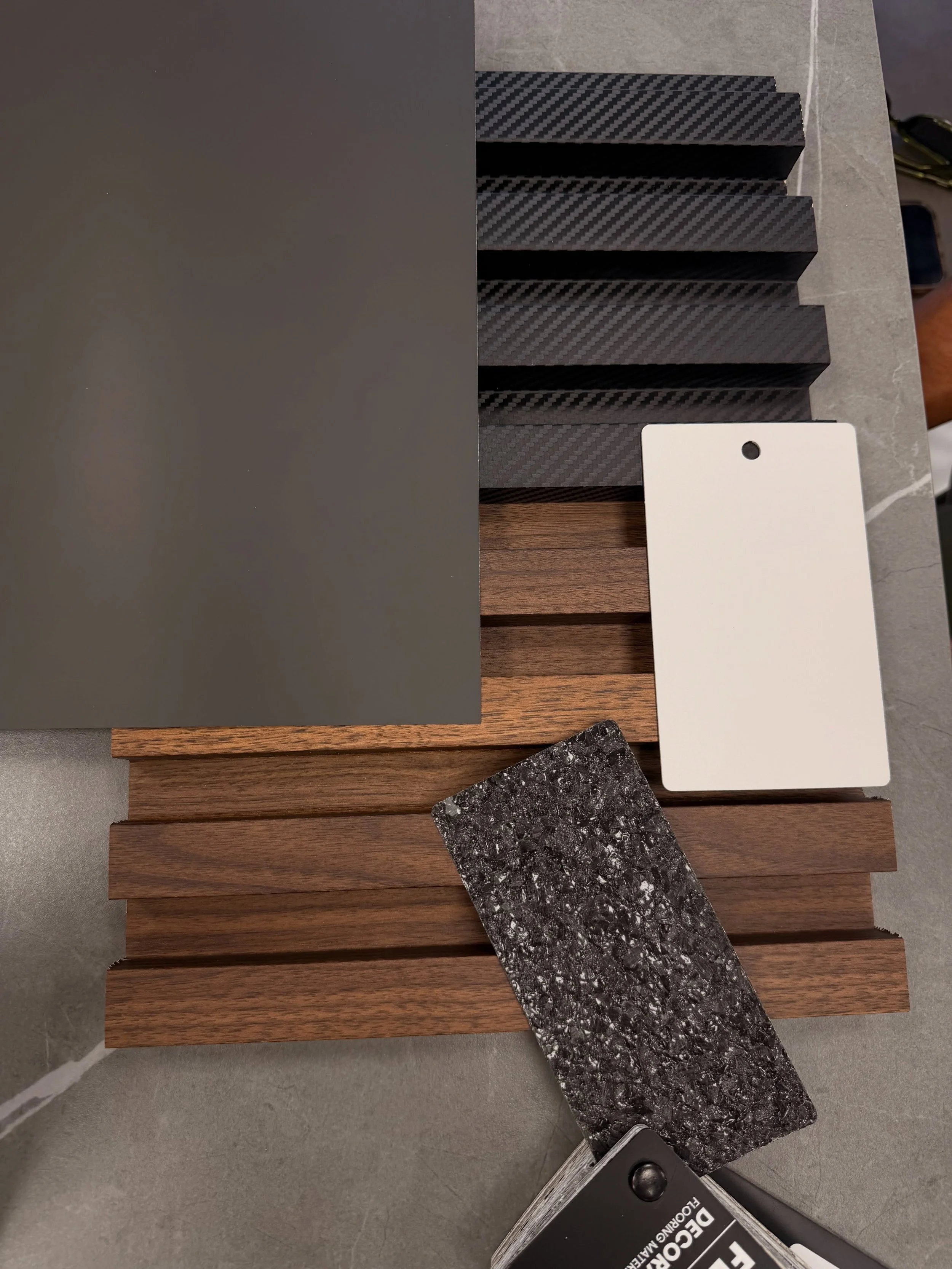 Design has many parts to it, and one of our favorites is having samples on hand. This flat lay was put together during a conceptual design presentation, allowing our client to see the products, colors, and finishes themselves, making design decisions