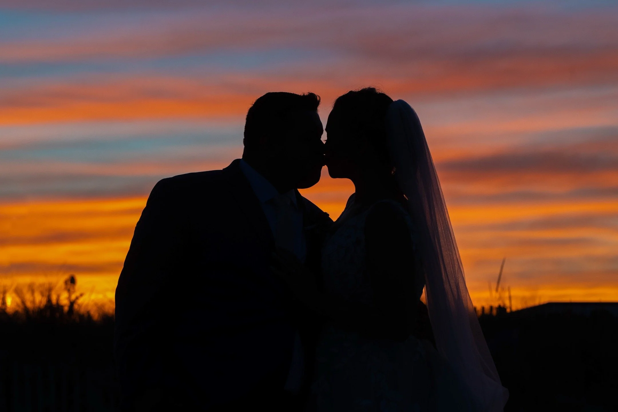 Sunset moments like this are pure magic. Just two people, tangled in love, silhouetted against the kind of sky you never forget.

#fernhollowweddings #cinematicweddingphotography #sunsetwedding #silhouettelove #beachwedding #moodyweddingphotography #