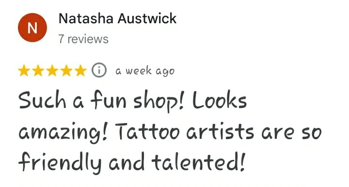 A five star Google review reading "Such a fun shop! Looks amazing! Tattoo artists are so friendly and talented! -Natasha Austwick"