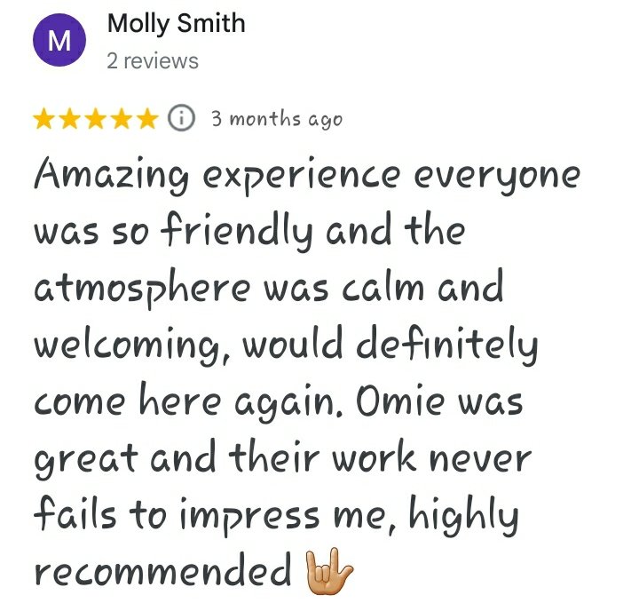 A five star Google review reading "Amazing experience everyone was so friendly and the atmosphere was calm and welcoming, would definitely come here again. Omie was great and their work never fails to impress me, highly recommended 🤟🏼 - Molly Smith