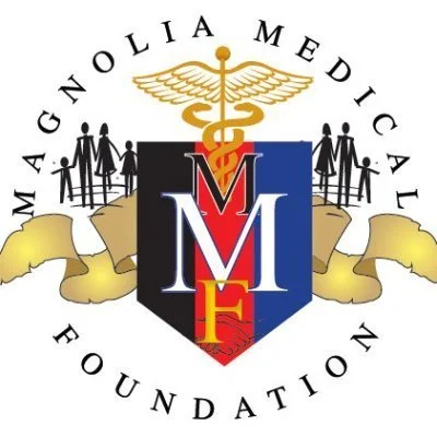 Logo of the Magnolia Medical Foundation featuring a shield with M M F initials, a caduceus symbol, and a group of people holding hands.