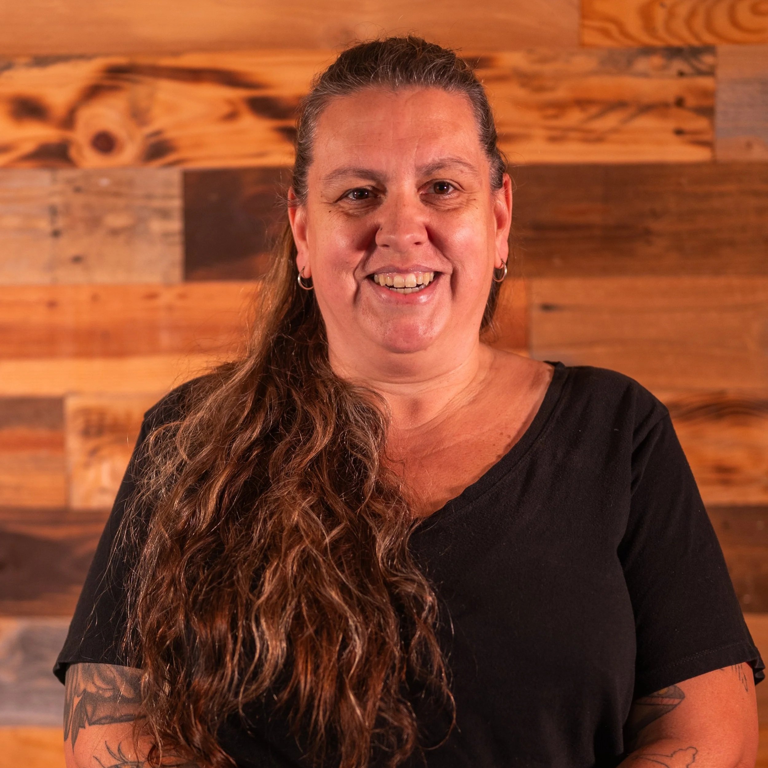 A glittering ball in the upper left corner with scattered small glimmers across a white background.