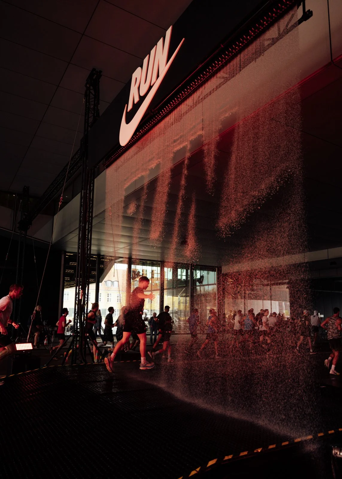 Large-scale water curtain installation acting as a water printer revealing Nike logo during Copenhagen Marathon