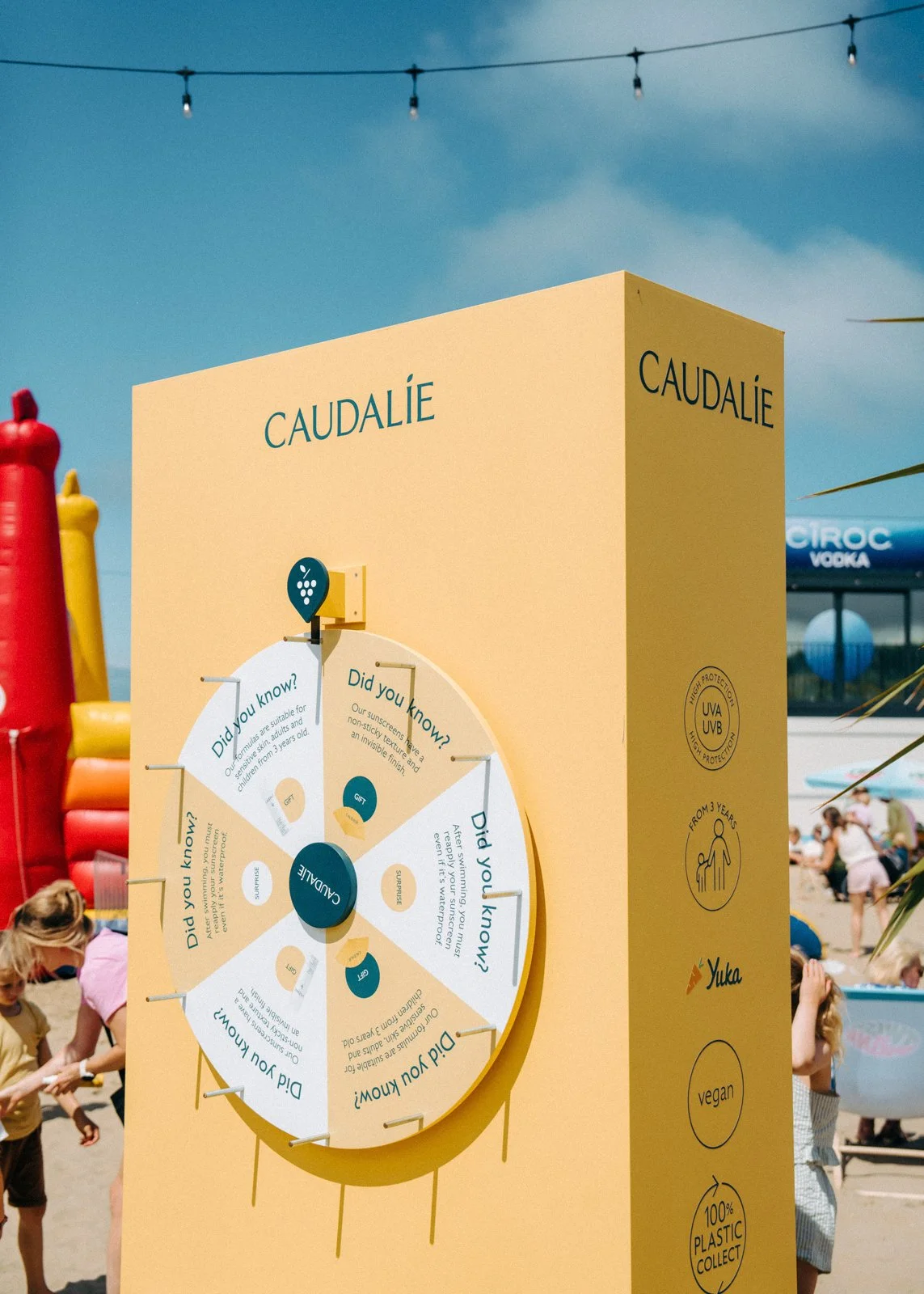 Custom-built beach booth engineered for sand installation and weather resistance during summer activation