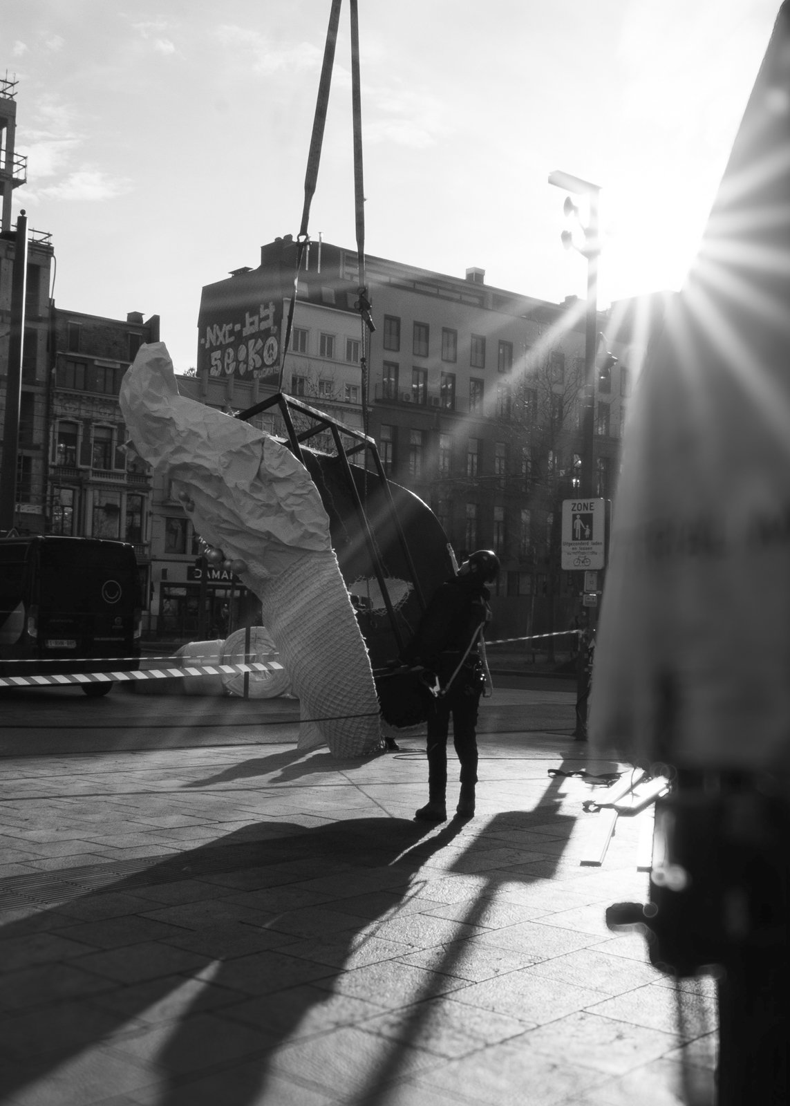 Masquerade-themed installation with decorative ribbons and floral detailing