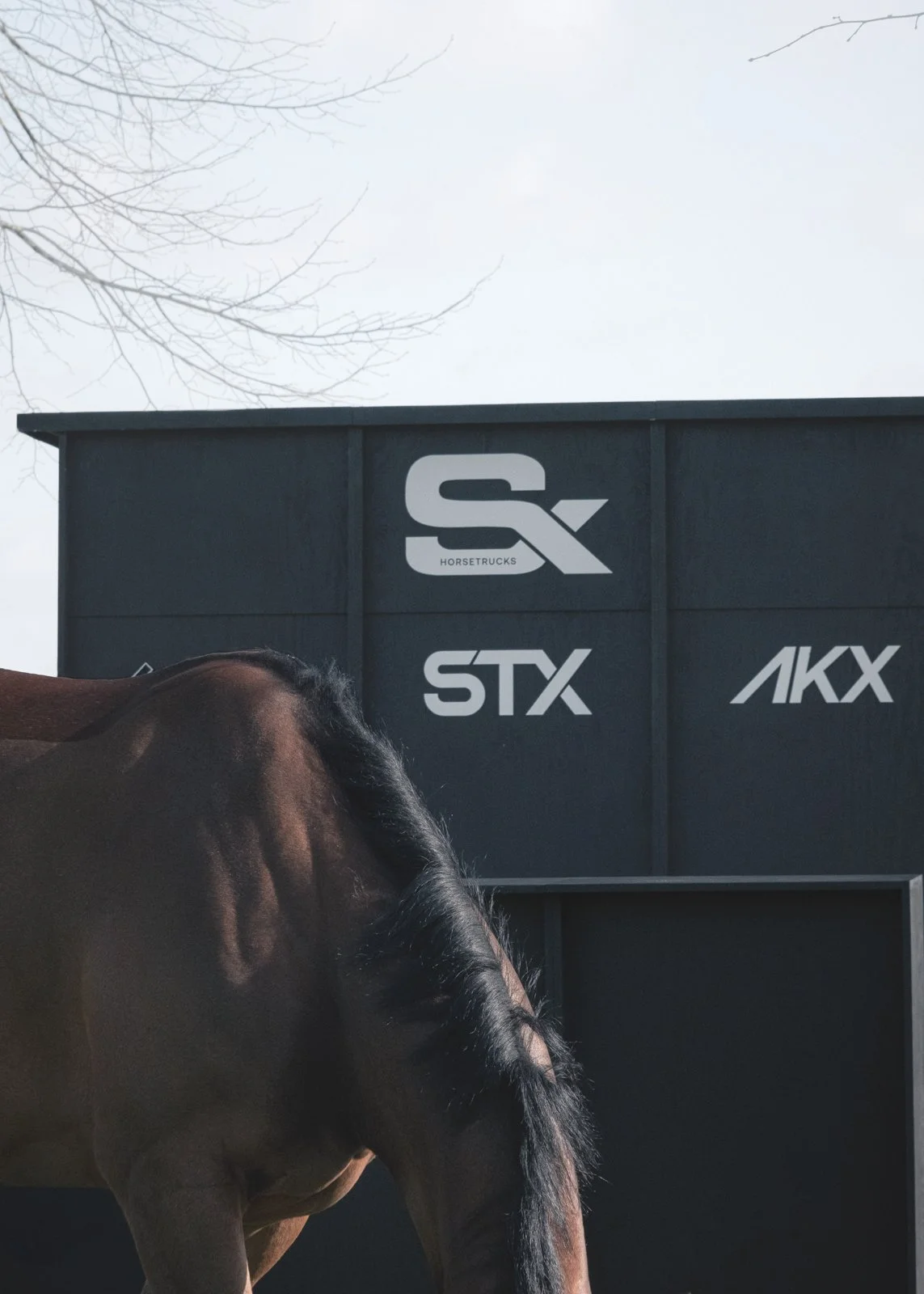 Luxury trade show booth with integrated video panels and bar structure