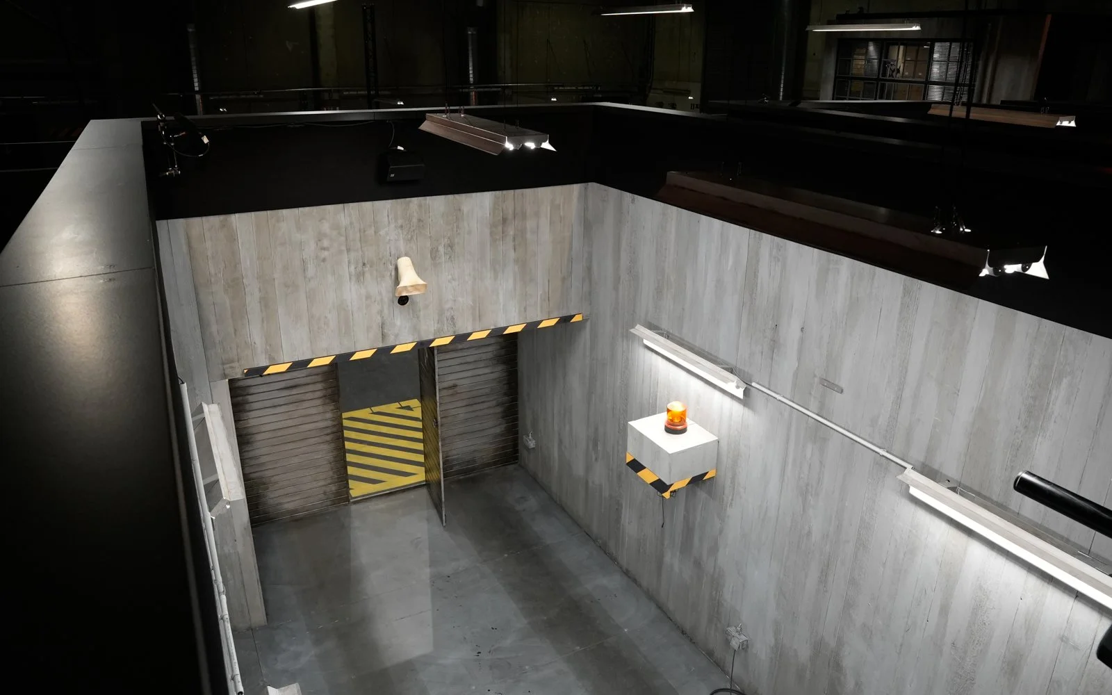 Custom-built game boxes with audience tribune viewing from above