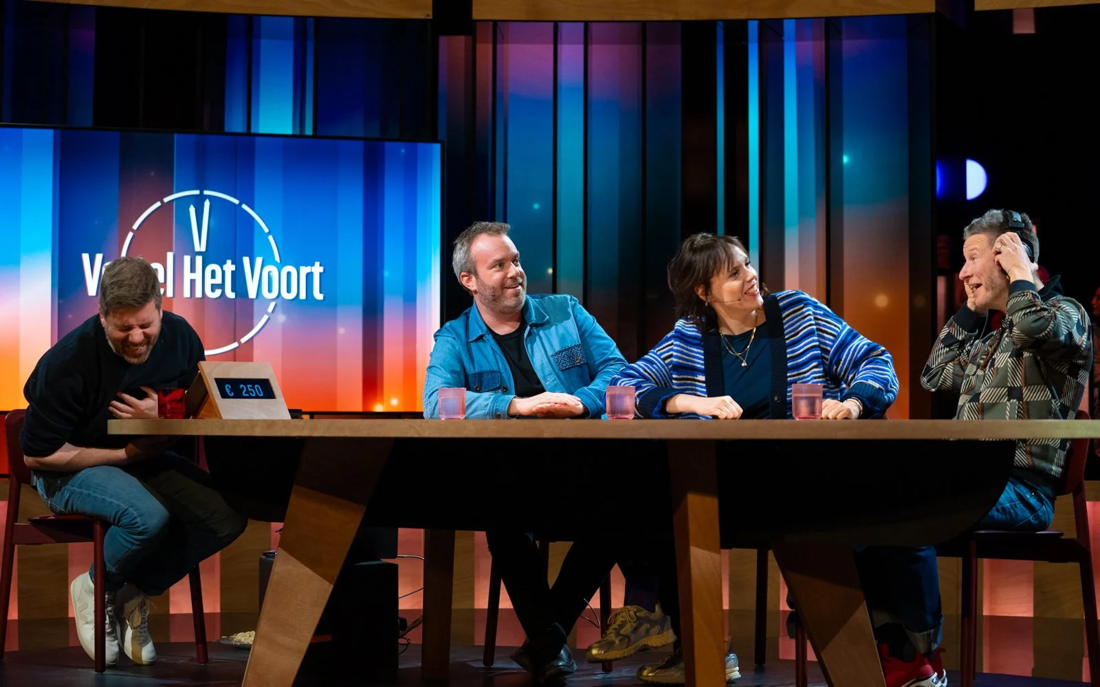 Television studio with host, panel and audience in one cohesive space