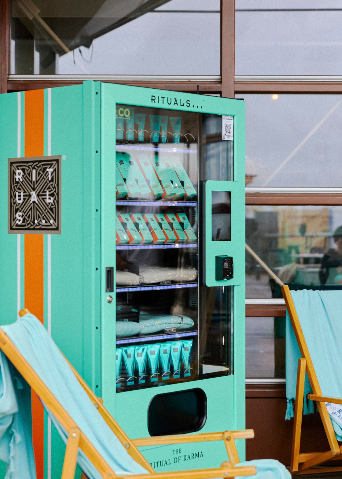 Custom-built beach installation engineered for long-term outdoor use with cohesive Rituals identity across entire site