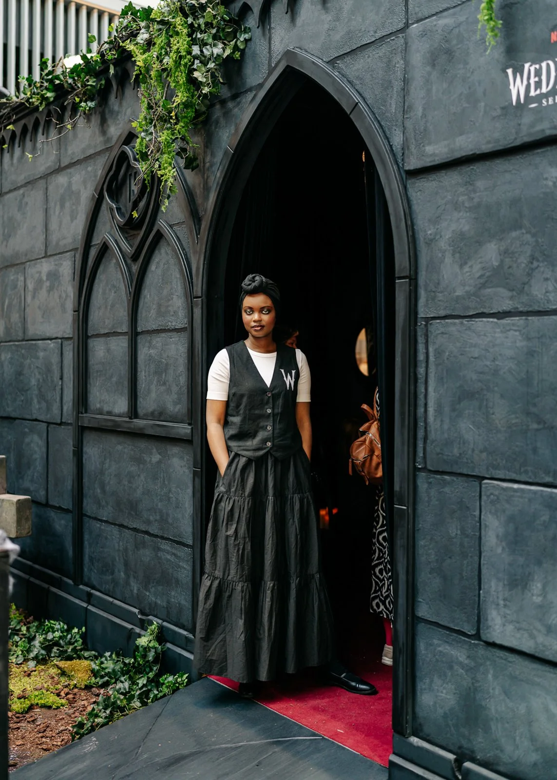 Custom-built Wednesday environment with actors and live cello music