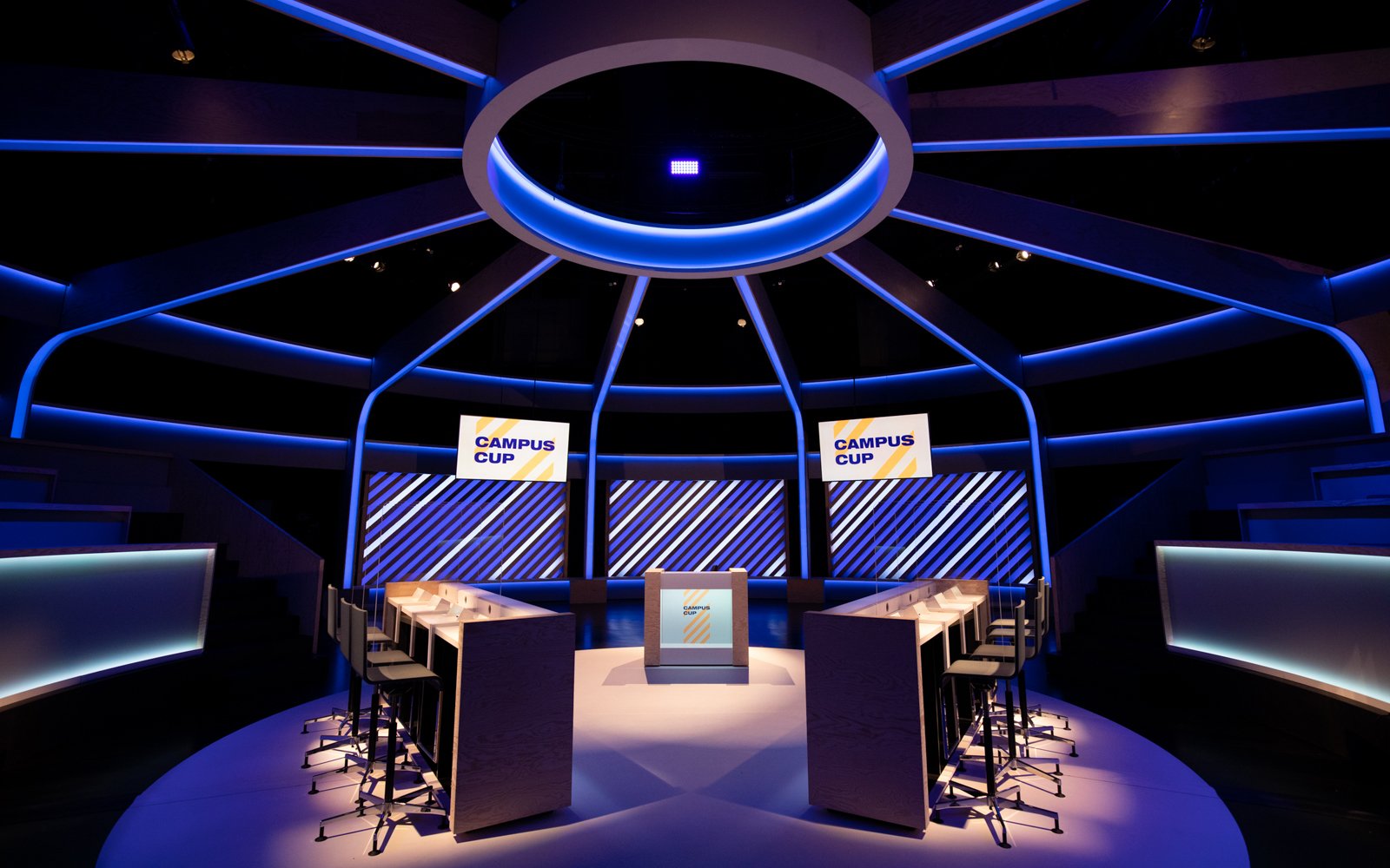 Aula-inspired studio layout with integrated lighting and camera logic