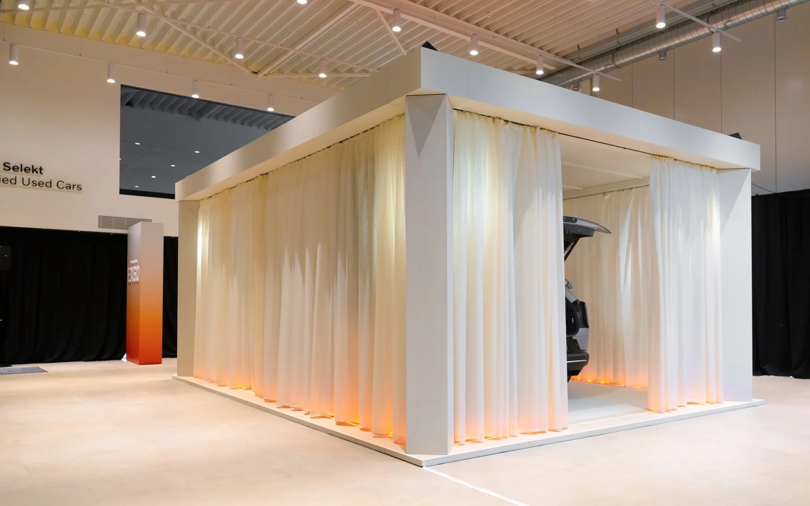 Premium car launch environment with integrated light and audio system